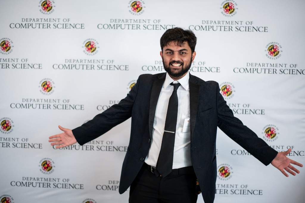 Harshit at UMD CS Department — arms spread wide